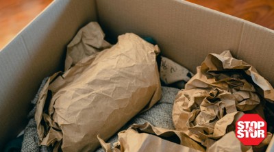 antique items wrapped in paper in box