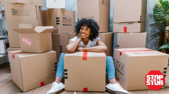 woman sitting with boxes